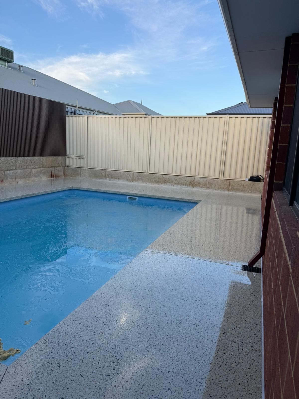 Pool with exposed aggregate surround